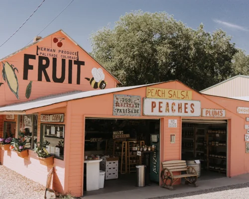 front of a small business that sells fruits