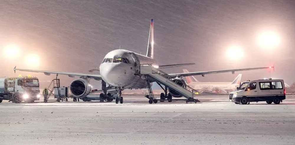 boeing cargo-airplane-hauling winter clothes parked on snowy runway