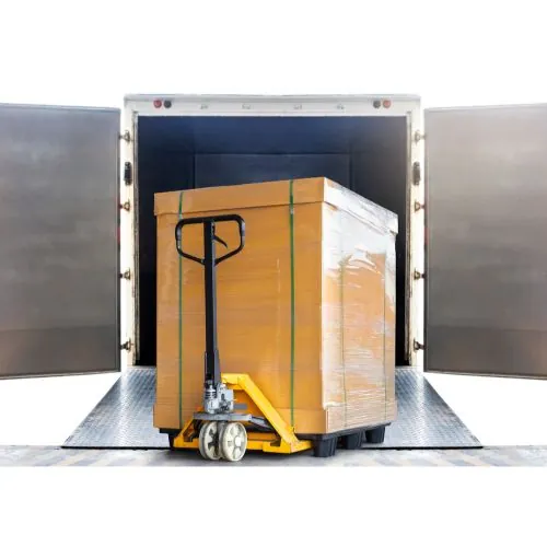 pallet of garage tiles on a lift gate being loaded into a truck