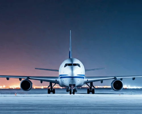 freighter airplane on tarmac at night