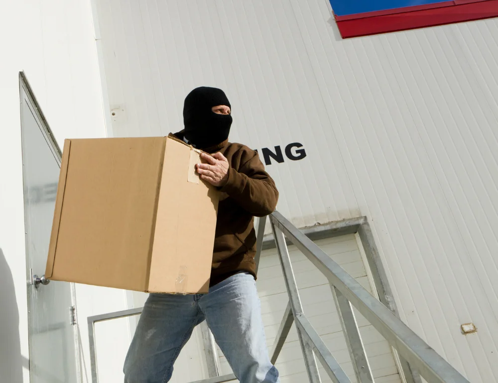 Cargo-theft-stealing-package-from-warehouse