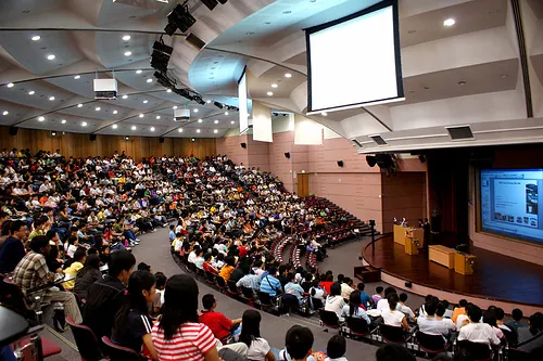 campus auditorium packed with students 