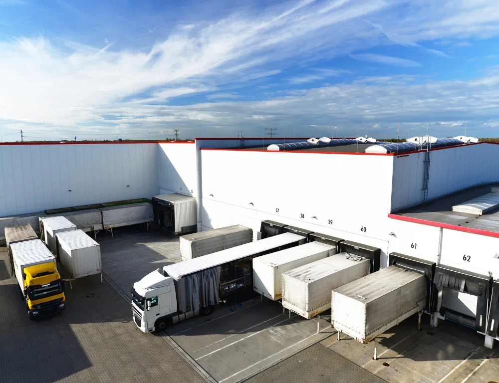 trucks parked at a warehouse