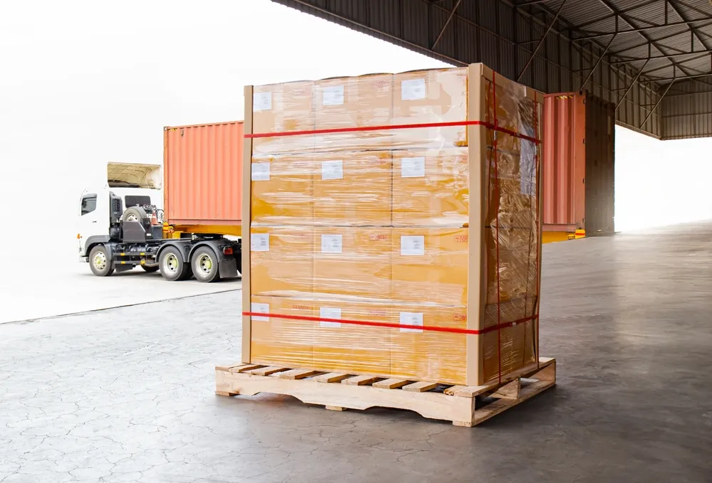 single shrink wrapped pallet sitting on a dock