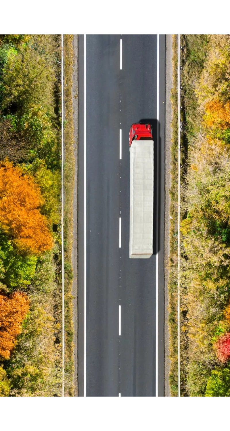 a red truck on highway top down view