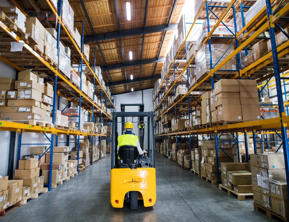 First Mile Shipping Man Riding Forklift Through Warehouse