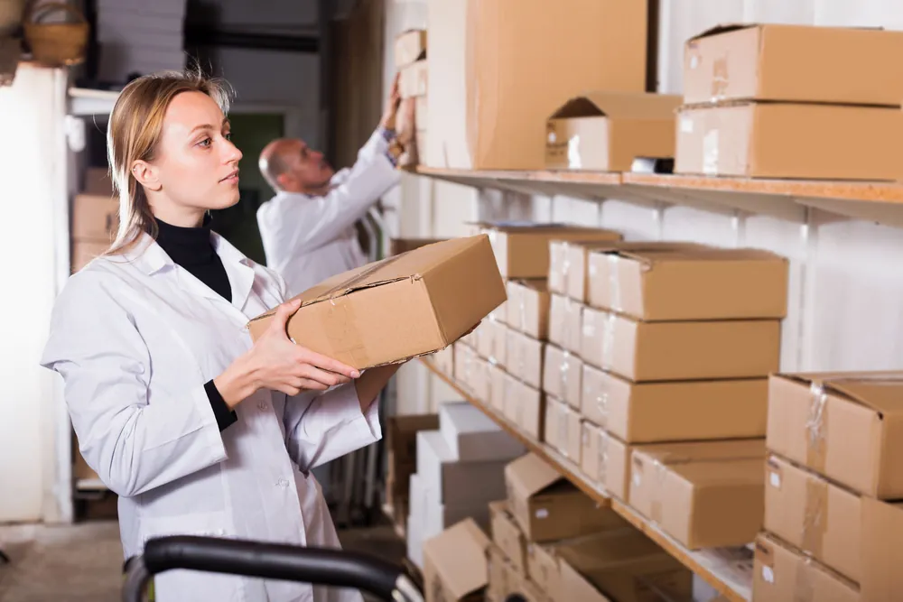 Doctor Shuffling boxes of Medicine