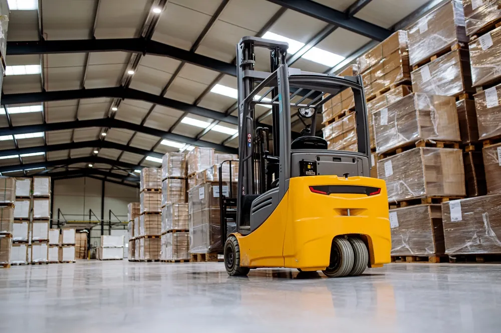 Freight-Warehousing-forklift-traveling-through-warehouse-aisles