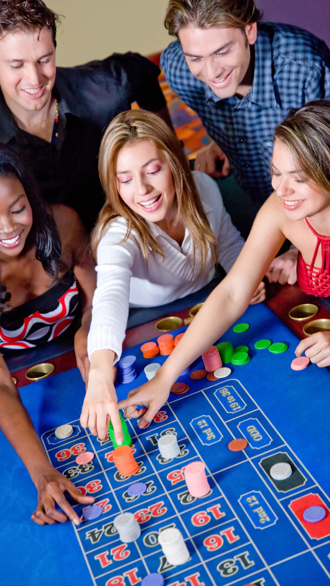 three ladies playing a casino game