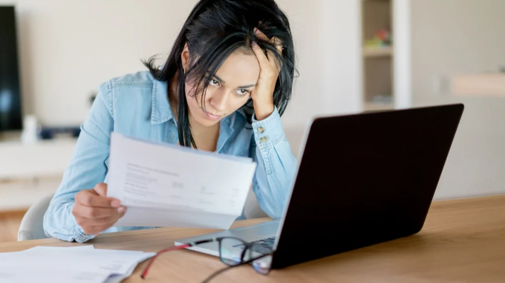 What are Freight Billing Adjustments lady grumbling looking at bills on her laptop