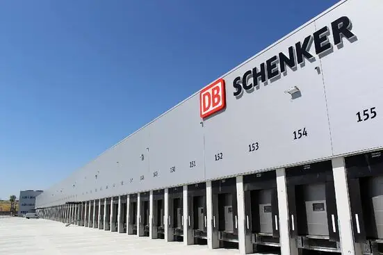 USA Truck (DB Schenker) Freight Rates warehouse exterior with DB Schenker logo sign on building heading picture