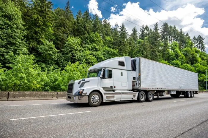 white Truck driving on road