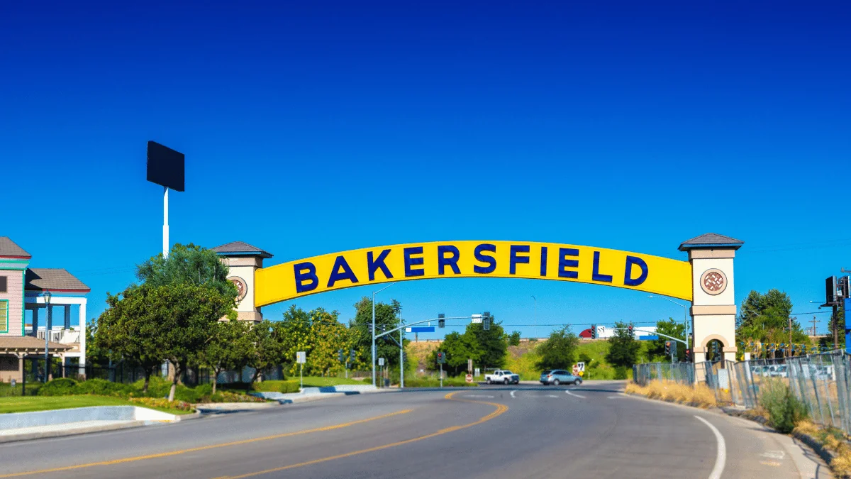 Bakersfield Freight Shipping yellow arch sign with Bakersfield on it over street