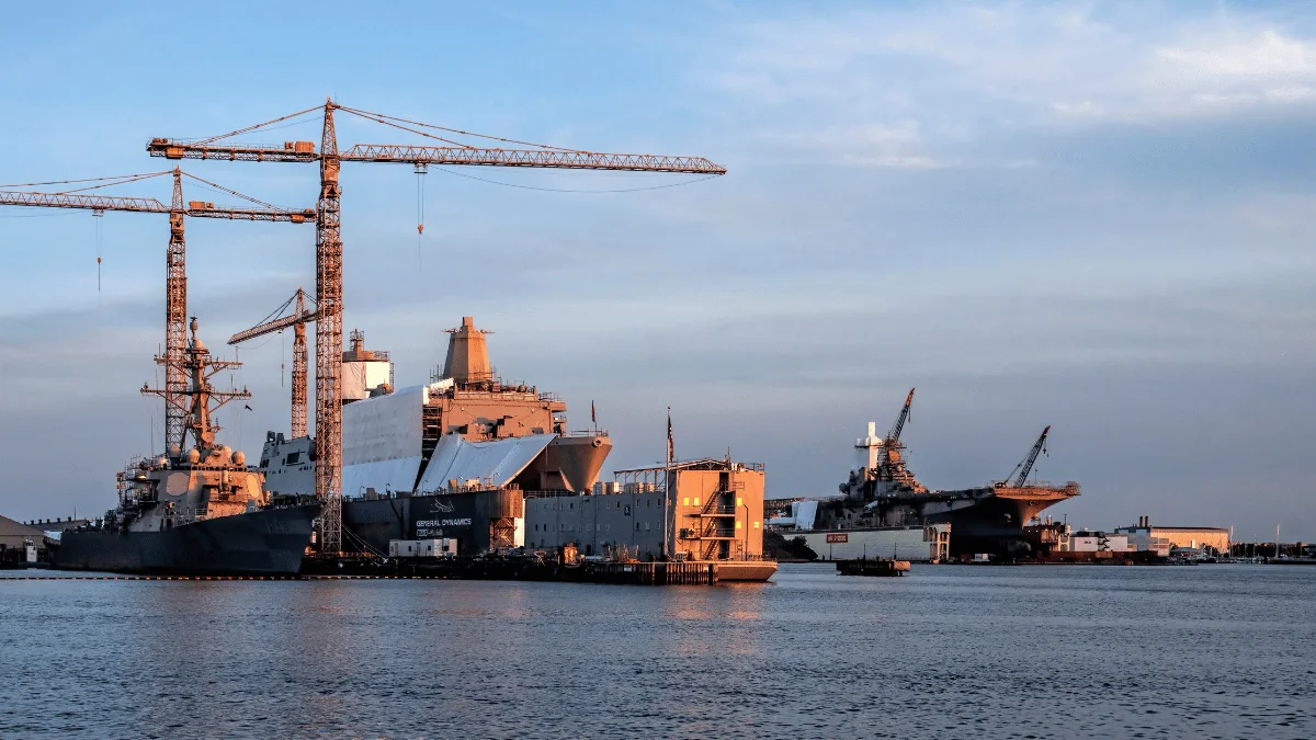 Norfolk Freight Shipping container ships docked at Norfolk port with container cranes next to ships