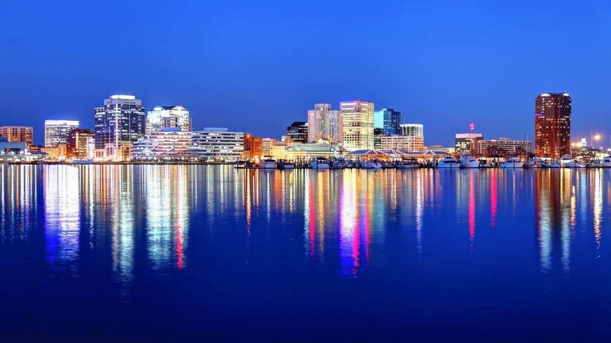 Norfolk Freight Shipping view of Norfolk cityscape at night from the water