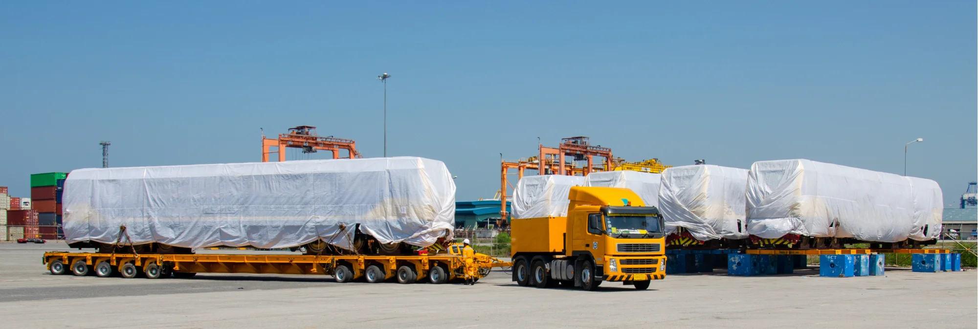 large flatbed holding a train car 