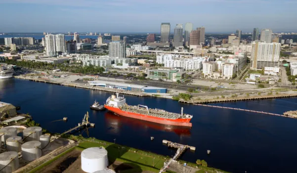 Tampa Freight Shipping port of tampa aerial with container ship cruising down river