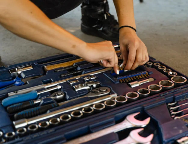 hands inside a toolbox