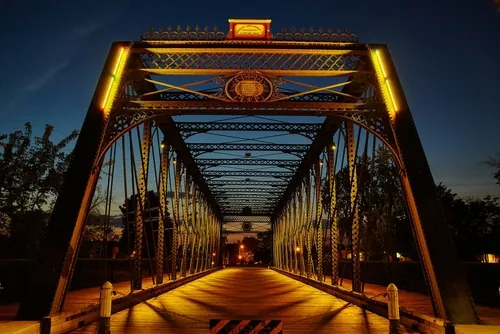 warmly lit historical bridge at twilight