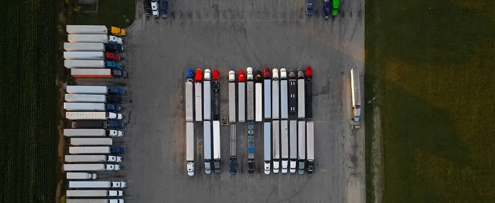 top down view of trucks parked at a truck stop