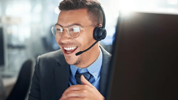 Customer Service Agent talks happily with Customer