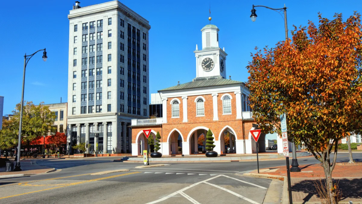 Fayetteville Freight Shipping street view of clock tower center of Hay Street next to a tall white office building