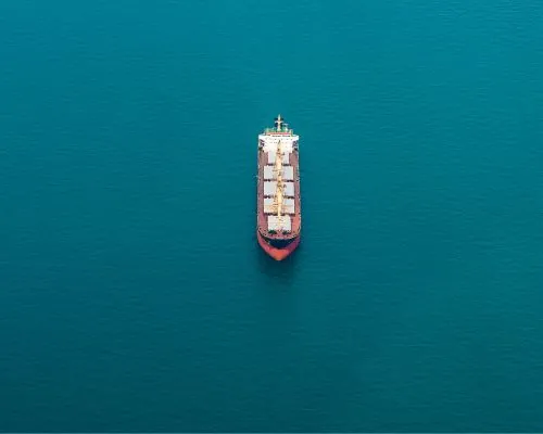 ariel view of a container ship on the open ocean