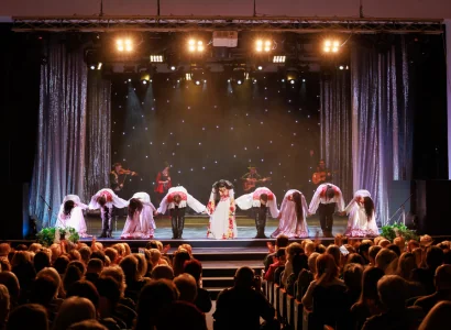 Performers and Singers taking a bow on stage