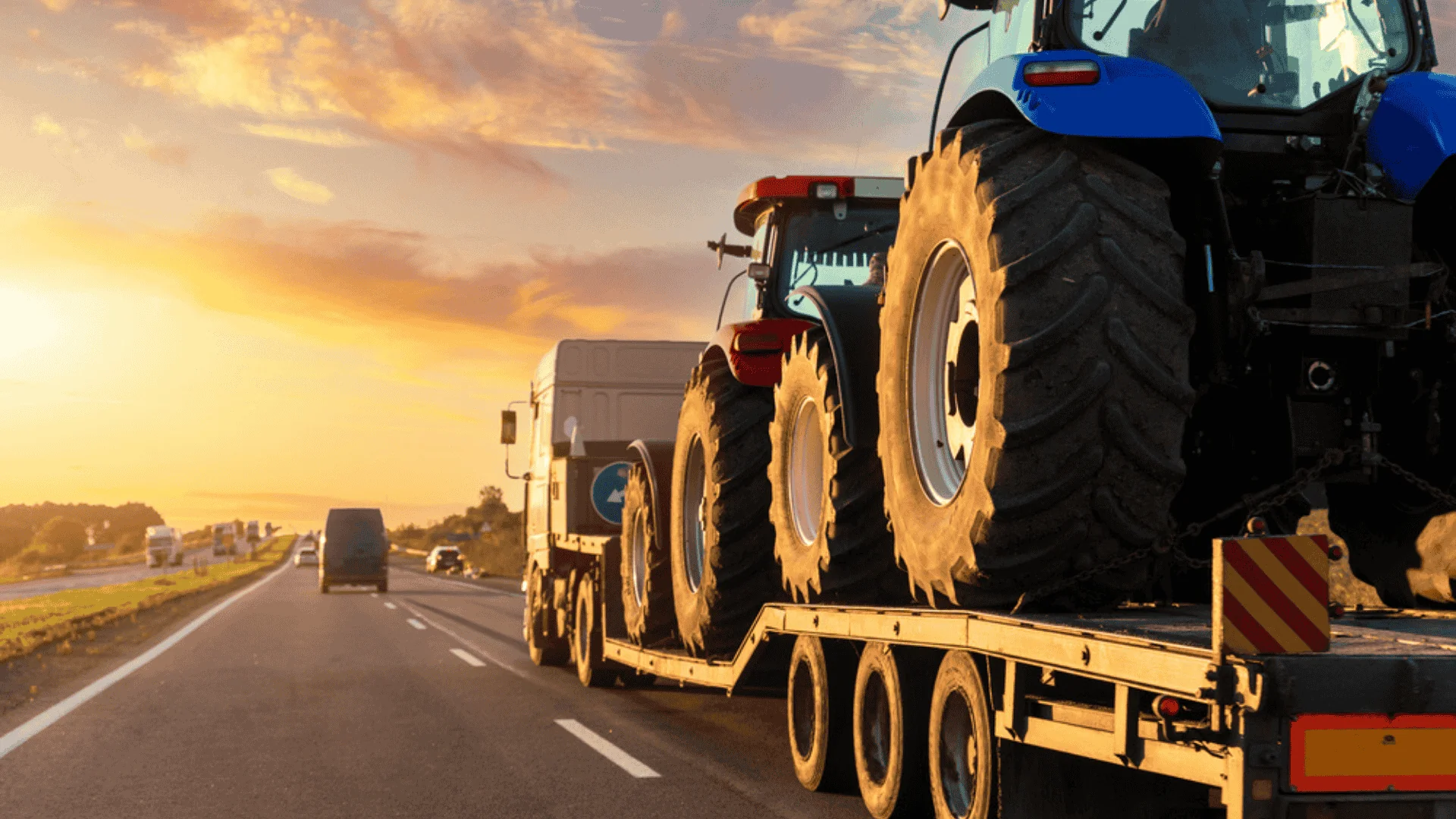 tractors on a flatbed truck