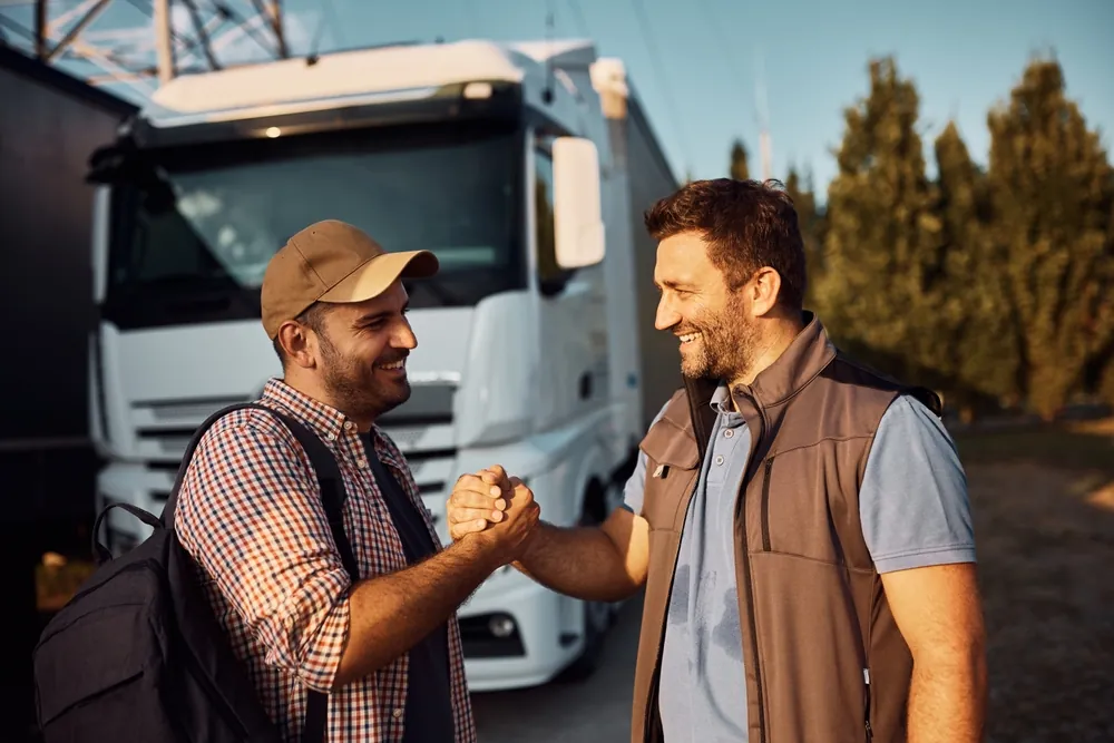 Truck drivers shaking hands 