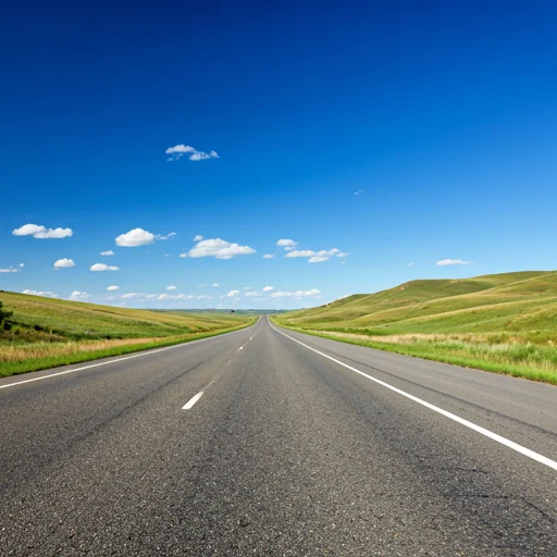 a freeway running through the green rolling hills of Montana