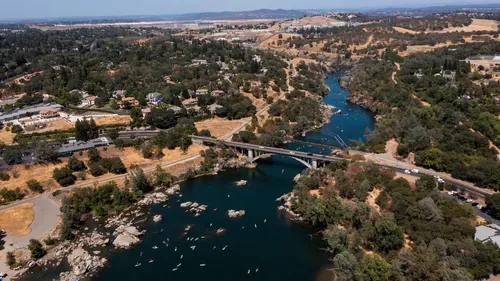 daytime aerial view of the american river and the city