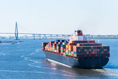 A cargo ship departing from the Port of Charleston