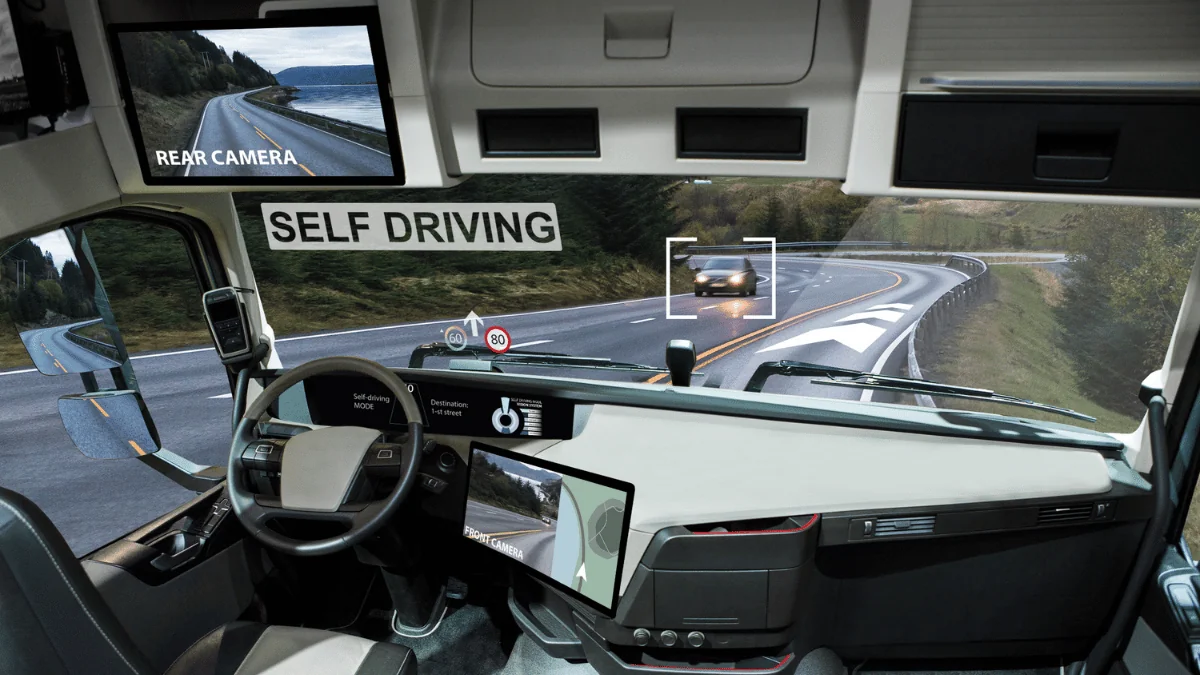 Self-Driving Vehicles inside of a self-driving truck's cab as it detects a car passing by on the other side of the road