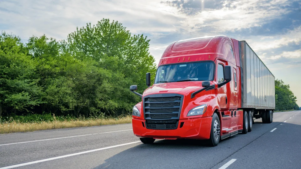 Shared Economy in Logistics red semi truck on the road