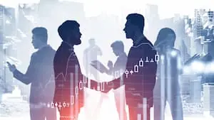 Shared Economy in Logistics two businessmen shaking hands surrounded by business people PREVIEW blog version