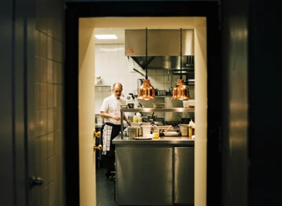 doorway looking into a restaurants kitchen